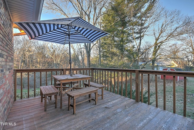 deck featuring outdoor dining area