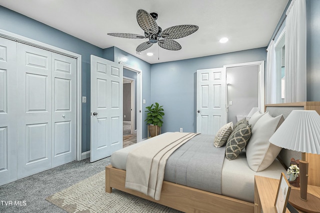 bedroom featuring recessed lighting, a closet, light colored carpet, and a ceiling fan