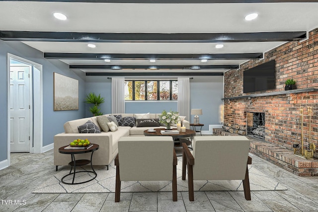 living room featuring beamed ceiling, recessed lighting, brick wall, baseboards, and a brick fireplace