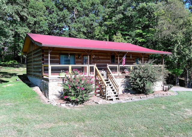 view of front facade with a front lawn and a porch