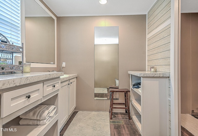 kitchen with dark wood-type flooring and white cabinets