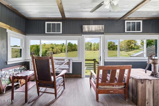 sunroom with ceiling fan