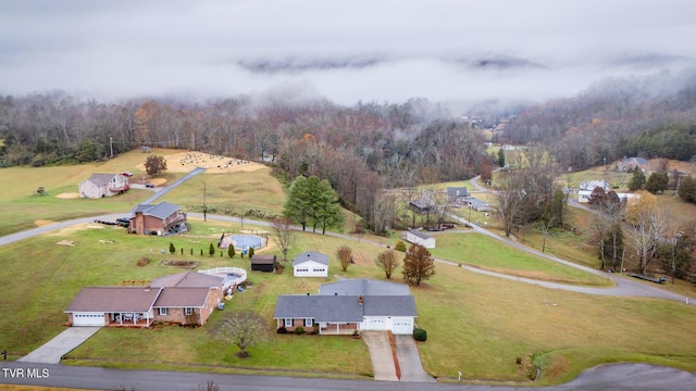 birds eye view of property featuring a rural view