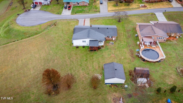 birds eye view of property with a residential view