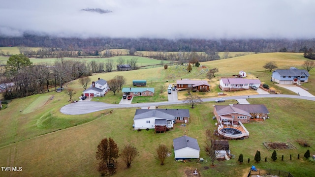 birds eye view of property featuring a rural view