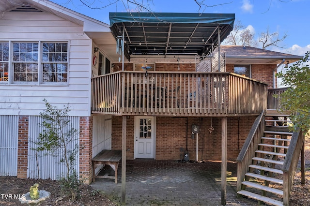 rear view of house with a deck