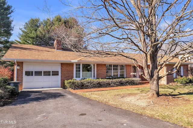 ranch-style house featuring a garage