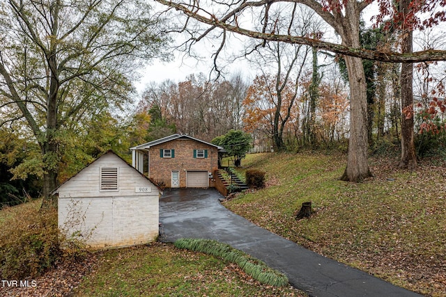 view of side of property with a garage