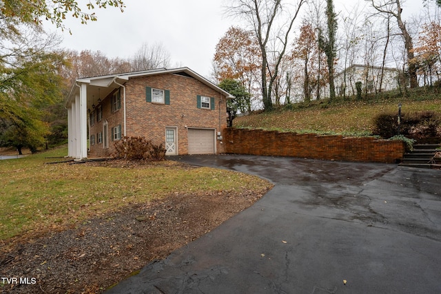 view of property exterior featuring a lawn and a garage