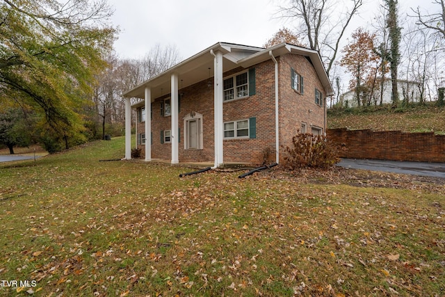 view of property exterior featuring a lawn