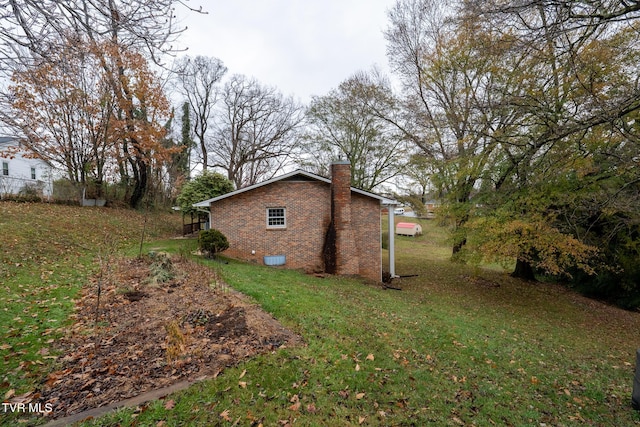 view of side of home featuring a yard