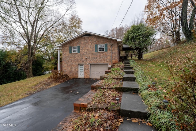 view of side of property with a garage