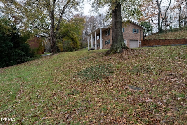 view of yard featuring a garage