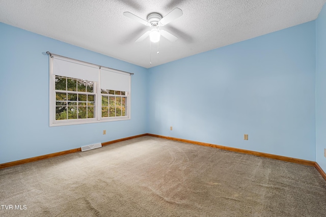 unfurnished room with carpet flooring, a textured ceiling, and ceiling fan