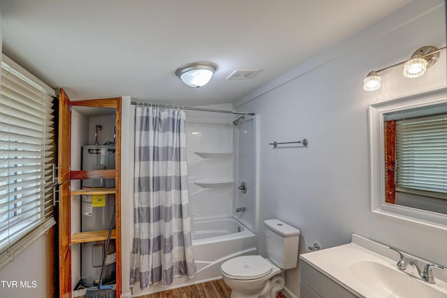 full bathroom with vanity, electric water heater, shower / bath combo with shower curtain, wood-type flooring, and toilet