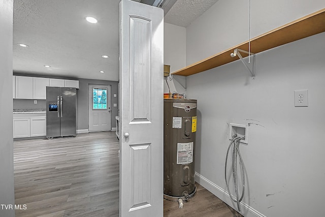 utility room with electric water heater