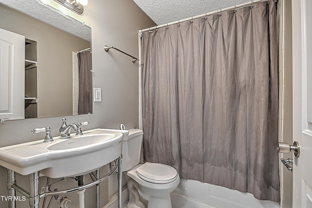 bathroom featuring shower / tub combo, a textured ceiling, and toilet