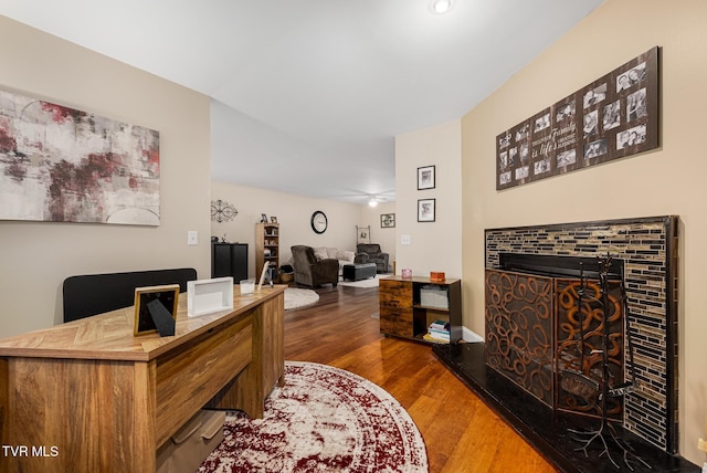 office area featuring ceiling fan and dark wood-type flooring