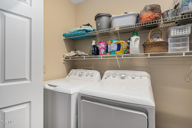 washroom featuring washing machine and dryer