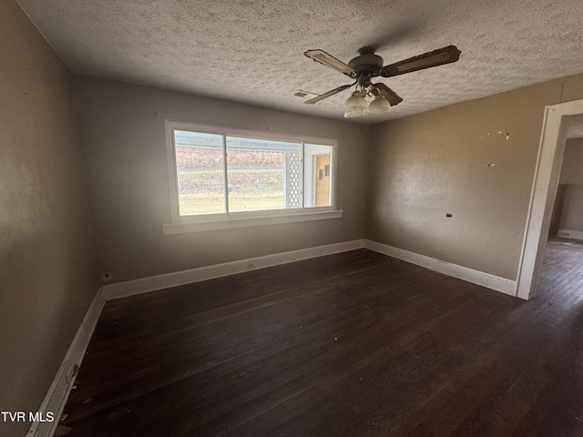 unfurnished room featuring a textured ceiling, ceiling fan, and dark wood-type flooring