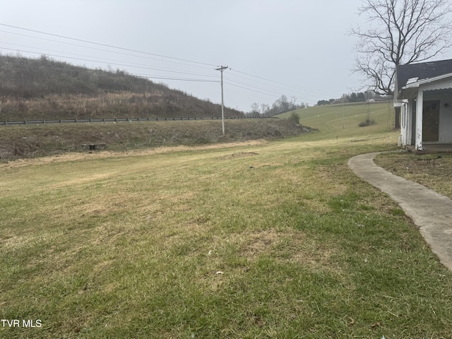 view of yard with a rural view