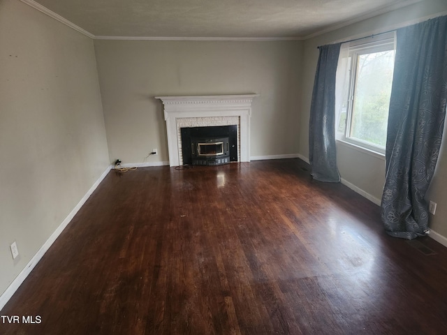 unfurnished living room with dark hardwood / wood-style floors and ornamental molding