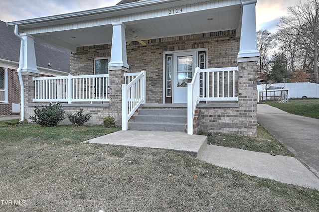 entrance to property featuring covered porch