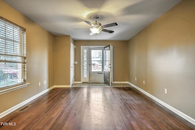 spare room featuring hardwood / wood-style floors and ceiling fan