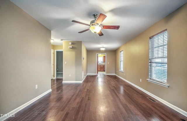 interior space featuring ceiling fan and dark wood-type flooring