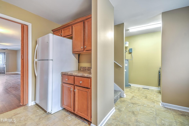 kitchen with white fridge and light hardwood / wood-style floors