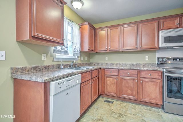 kitchen with sink and white appliances