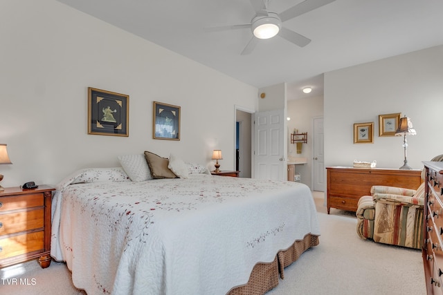 bedroom featuring ensuite bath, ceiling fan, and light colored carpet