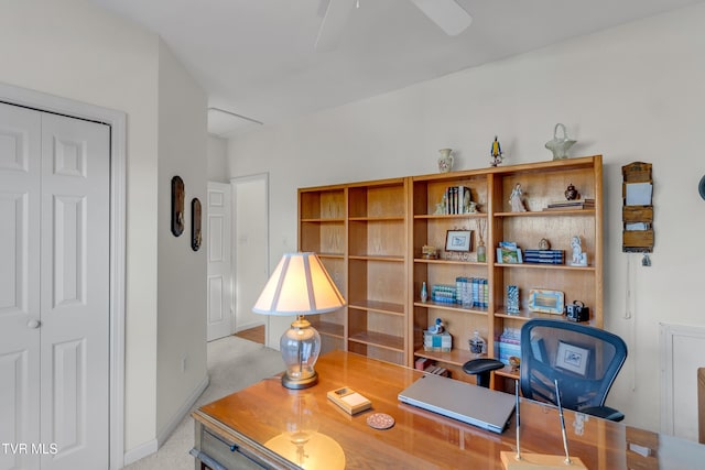 carpeted home office with ceiling fan