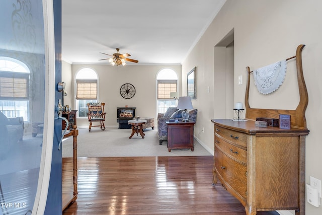 interior space with plenty of natural light, ceiling fan, and ornamental molding