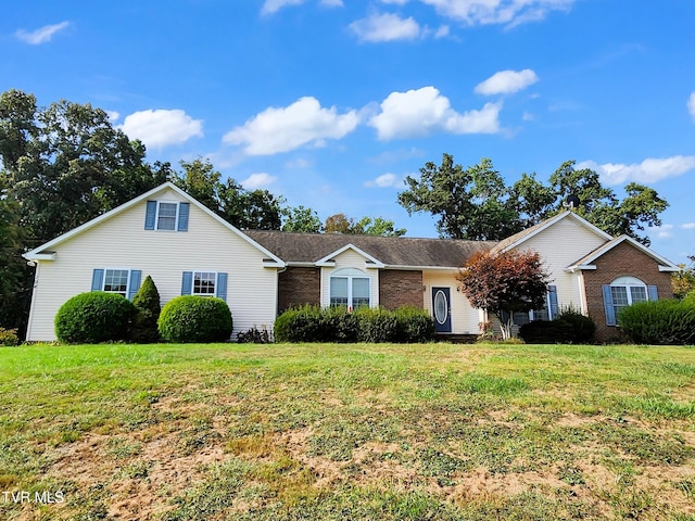 ranch-style house with a front lawn