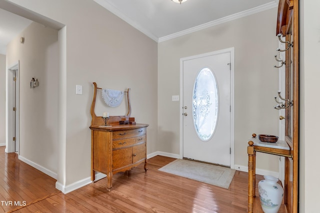 entrance foyer with light hardwood / wood-style floors and ornamental molding