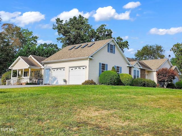 view of front facade featuring covered porch, a garage, and a front yard