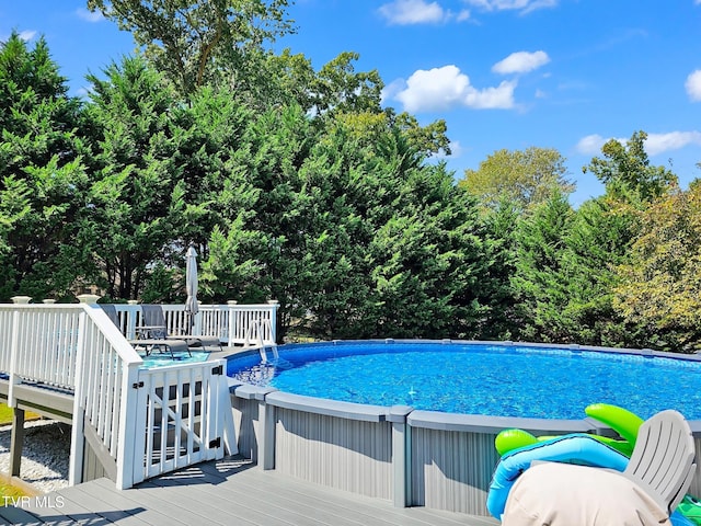 view of pool with a wooden deck