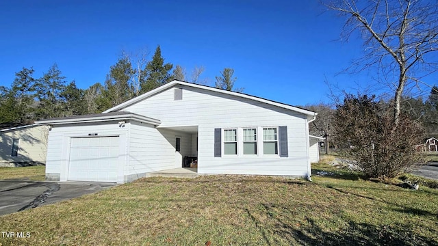 single story home featuring a garage and a front yard