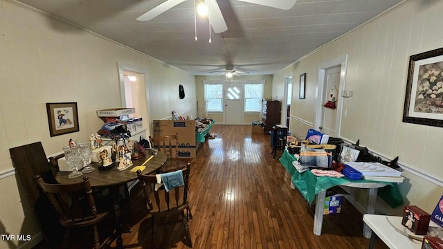 dining room with dark hardwood / wood-style flooring and ornamental molding