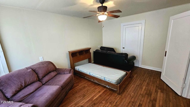 living room with dark hardwood / wood-style floors and ceiling fan