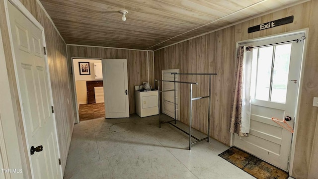 interior space with washer / clothes dryer, wooden walls, and wooden ceiling