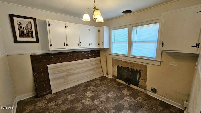 washroom featuring a chandelier