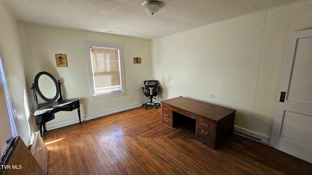 unfurnished office with dark hardwood / wood-style flooring and a textured ceiling