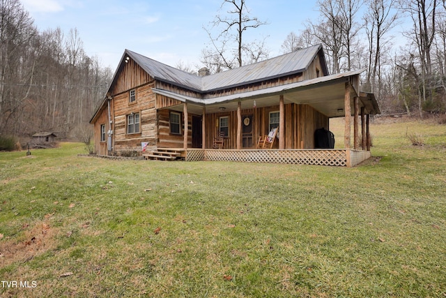 back of property featuring a yard and a porch