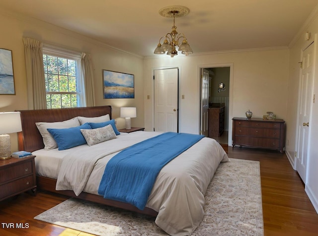 bedroom featuring dark hardwood / wood-style flooring, an inviting chandelier, and crown molding