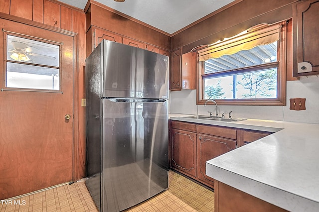 kitchen with stainless steel refrigerator and sink