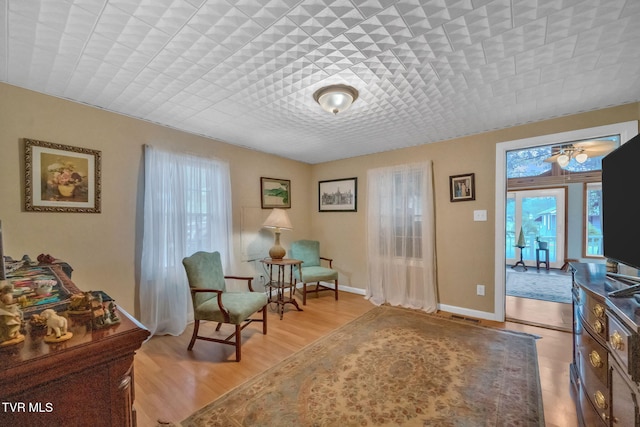 living area with light hardwood / wood-style floors