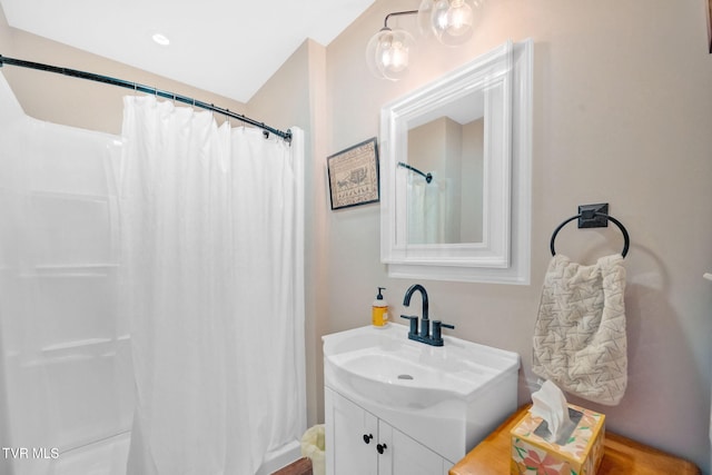 bathroom with vanity and walk in shower