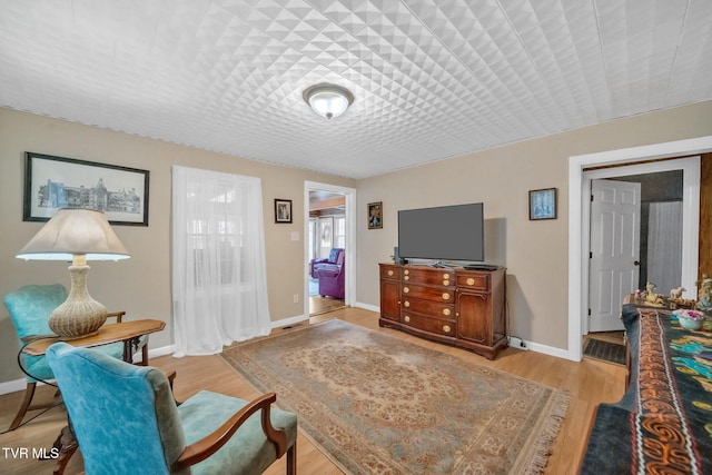 sitting room featuring light hardwood / wood-style flooring